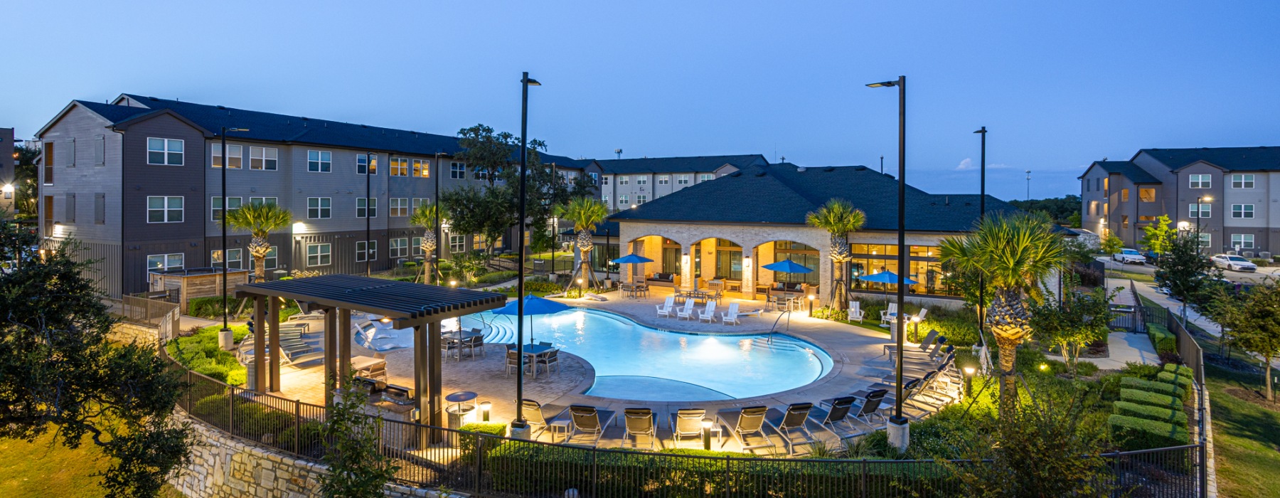 Pool with Outdoor Lawn & Cabana at Dusk